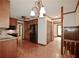 Spacious kitchen featuring oak cabinets, black appliances, and hardwood floors at 3409 Shorelake Dr, Tucker, GA 30084