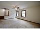 Spacious living room featuring neutral carpet, ceiling fan, and natural light at 3409 Shorelake Dr, Tucker, GA 30084