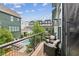 Relaxing balcony with chairs overlooking the community pool, trees, and neighboring buildings perfect for entertaining at , Atlanta, GA 30315