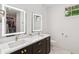 Modern bathroom with double vanity, quartz countertops, and a walk-in closet with plenty of storage space at , Atlanta, GA 30315