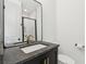 Stylish bathroom with a sleek vanity, modern faucet, and elegant mirror at , Atlanta, GA 30315