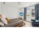 Bright bedroom with large window, ceiling fan, and TV at , Atlanta, GA 30315