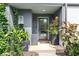 Home entrance with potted plants, modern lighting, and a glass paneled door for natural light at , Atlanta, GA 30315