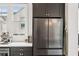 Kitchen with stainless steel refrigerator and dark cabinetry at , Atlanta, GA 30315