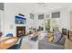 Bright living room with a grey sofa, dining table, and a fireplace at , Atlanta, GA 30315