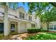 Two-story townhome with a charming entrance, complemented by well-maintained landscaping and inviting curb appeal at 1003 Cannongate Sw Xing, Marietta, GA 30064