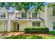 Charming townhome with a welcoming front porch, lush landscaping, and classic architectural details at 1003 Cannongate Sw Xing, Marietta, GA 30064
