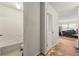 Hallway featuring a bathroom, a bedroom and debris across the floor at 1003 Cannongate Sw Xing, Marietta, GA 30064