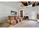 Living room featuring a fireplace, ladder, and damaged ceiling, creating a unique opportunity for a complete renovation project at 1003 Cannongate Sw Xing, Marietta, GA 30064