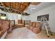 Spacious room with stairs and damaged ceiling, presenting a blank canvas for a full renovation and custom design at 1003 Cannongate Sw Xing, Marietta, GA 30064