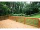 Enjoy outdoor living on this wooden deck with views of the lush, green backyard and mature trees at 1258 Campbellton Sw Rd, Atlanta, GA 30310