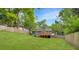 A well-maintained backyard featuring an expansive lawn and mature trees at 1258 Campbellton Sw Rd, Atlanta, GA 30310