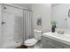 This stylish bathroom features a walk-in shower with white marble tiling and modern fixtures at 1258 Campbellton Sw Rd, Atlanta, GA 30310
