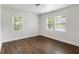 Bright bedroom featuring tile floors, fresh paint, and large windows that flood the room with natural light at 1258 Campbellton Sw Rd, Atlanta, GA 30310