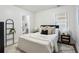 Cozy bedroom with plush bedding, a patterned rug, and ample natural light at 1258 Campbellton Sw Rd, Atlanta, GA 30310