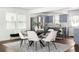 Elegant dining area with modern lighting, stainless steel appliances, and seating for six at 1258 Campbellton Sw Rd, Atlanta, GA 30310