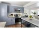 Well-lit kitchen with stainless steel appliances, stylish cabinets, and an open layout at 1258 Campbellton Sw Rd, Atlanta, GA 30310
