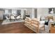 Open living space seamlessly connecting the kitchen and dining area with hardwood floors at 1258 Campbellton Sw Rd, Atlanta, GA 30310