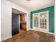 Dining room with wood floors and French doors, open to the kitchen at 136 Peachtree Memorial Nw Dr # Pa4, Atlanta, GA 30309