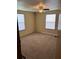 Bedroom with neutral walls, carpet floors, with ceiling fan and two windows providing natural light at 1631 Billy Bullock Rd, Dallas, GA 30157