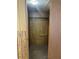 Walk-in closet with carpet and wood panel walls with clothing rack in the center at 1631 Billy Bullock Rd, Dallas, GA 30157