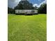 Charming single-story home featuring a small porch and well-maintained lawn at 1631 Billy Bullock Rd, Dallas, GA 30157