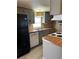 Well-lit kitchen with a double sink, wooden countertops, and modern appliances at 1631 Billy Bullock Rd, Dallas, GA 30157