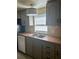 Kitchen features updated cabinets, new countertops, and stainless-steel appliances at 1631 Billy Bullock Rd, Dallas, GA 30157