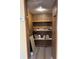 Walk-in pantry with wood-lined walls and shelving at 1631 Billy Bullock Rd, Dallas, GA 30157