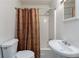 Cozy bathroom with a shower-tub combo, neutral walls, tile floors, and a functional layout at 223 Dogwood Ln, Lawrenceville, GA 30046