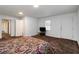 Neutral bedroom featuring ample space, neutral walls, carpeted floors, and a private entrance door at 223 Dogwood Ln, Lawrenceville, GA 30046