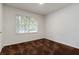 Simple bedroom featuring neutral walls, carpeted floors, and ample space for rest and relaxation at 223 Dogwood Ln, Lawrenceville, GA 30046