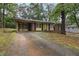 Charming single-story brick home with a well-maintained front yard surrounded by mature trees at 223 Dogwood Ln, Lawrenceville, GA 30046