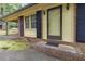 Close-up of the charming home's front entrance showing the brick facade and well-kept landscaping at 223 Dogwood Ln, Lawrenceville, GA 30046