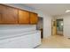 The kitchen has plenty of cabinets for storage, white counter tops and access to the back yard at 223 Dogwood Ln, Lawrenceville, GA 30046