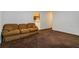 Cozy living room with plush carpeting, neutral walls, and a comfortable seating area at 223 Dogwood Ln, Lawrenceville, GA 30046