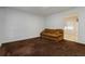 Cozy living room with plush carpeting, neutral walls, and a comfortable seating area at 223 Dogwood Ln, Lawrenceville, GA 30046