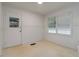 Well-lit room featuring neutral walls, tile floors, and access to the exterior of the house at 223 Dogwood Ln, Lawrenceville, GA 30046