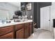 Bathroom featuring a double sink vanity, white-tiled wall, and modern fixtures at 2780 Lakeview Walk, Decatur, GA 30035
