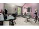 Bedroom setup as a salon with a brick accent wall, salon chair, and a work space at 2780 Lakeview Walk, Decatur, GA 30035