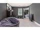 Stylish gray bedroom featuring a large beanbag, mirror, exercise equipment, and trendy decor at 2780 Lakeview Walk, Decatur, GA 30035