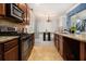 Contemporary kitchen with granite countertops, stainless steel appliances, and an adjacent dining area at 2780 Lakeview Walk, Decatur, GA 30035