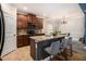 Well-lit kitchen boasts a center island with granite countertops, seating, and stainless steel appliances at 2780 Lakeview Walk, Decatur, GA 30035