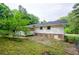 View of backyard with an exterior of home at 2923 Bicentennial Dr, Stone Mountain, GA 30087