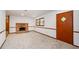 Cozy basement with a brick fireplace and neutral carpet, perfect for entertaining at 2923 Bicentennial Dr, Stone Mountain, GA 30087