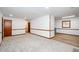 Spacious basement featuring new carpet, fresh paint, and warm wood trim at 2923 Bicentennial Dr, Stone Mountain, GA 30087