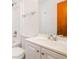 Bright bathroom featuring a vanity, faucet, and toilet at 2923 Bicentennial Dr, Stone Mountain, GA 30087