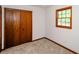 Cozy bedroom with carpet, closet and natural light from a window at 2923 Bicentennial Dr, Stone Mountain, GA 30087
