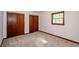 Bedroom featuring neutral walls, carpet floors, a window and a closet at 2923 Bicentennial Dr, Stone Mountain, GA 30087