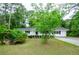 Charming home with a manicured lawn and mature trees at 2923 Bicentennial Dr, Stone Mountain, GA 30087